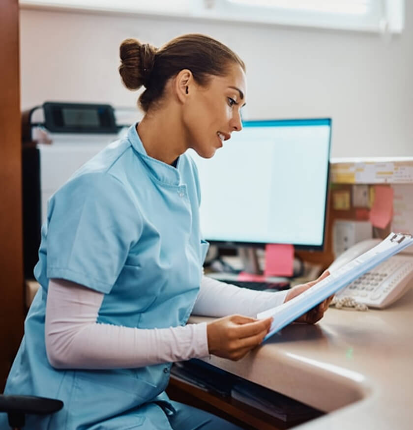 Nurse reviewing paperwork
